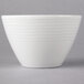 A white Villeroy & Boch porcelain bowl with wavy lines on it.