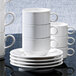 A stack of Villeroy & Boch white porcelain cups.