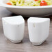 Villeroy & Boch white porcelain salt and pepper shakers on a table.