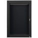 A black metal cabinet with a hinged door and key lock.