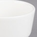 A close up of a Villeroy & Boch white porcelain bowl with a white rim.