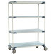 A MetroMax metal shelf cart with three shelves on wheels.
