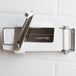 A white metal Swing-A-Way Wall Mount Can Opener with silver accents.