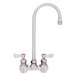 A Fisher wall mount faucet with two silver lever handles.