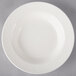 A close-up of a white Villeroy & Boch porcelain deep plate with a diamond pattern.