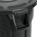 A black Rubbermaid BRUTE 44 gallon trash can with a lid.