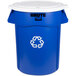 A blue Rubbermaid BRUTE recycling can with a white lid.