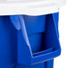A blue and white Rubbermaid BRUTE recycling can with a white lid.
