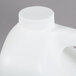 A white jug of Expo dry erase surface cleaner with a white cap.