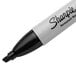 A close-up of a black Sharpie permanent marker with a white background.