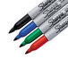 A close-up of a Sharpie permanent marker set with 4 different colors.