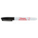 The Sharpie Pro Black Fine Point Industrial Permanent Marker with the red letter S on a white surface.