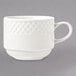 A white Libbey porcelain cup with a handle and a patterned design of stars and moons.