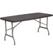 A brown rectangular Flash Furniture plastic folding table with legs.