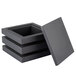 A stack of three black wooden cube risers, with one open.