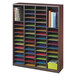 A Safco mahogany wood organizer with colorful papers in it.