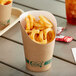 A Kraft paper cup of French fries.