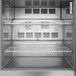 A Beverage-Air stainless steel worktop refrigerator with shelves.