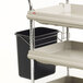 A white Metro utility cart with black bins and a black holder.