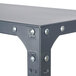 A Safco dark gray commercial steel shelving unit with rivets and screws.