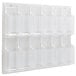 A white Safco wall-mount display rack with clear plastic pockets.