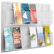 A Safco clear plastic wall-mount display rack with 12 compartments holding brochures.
