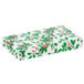 A white rectangular candy box with green and red holly leaves and berries on it.