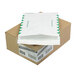 A brown box with a white label and green letters for Survivor R4510 Tyvek First Class Expansion Mailers.