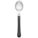 A WNA Comet Reflections Duet stainless steel look plastic teaspoon with a black handle.