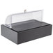 A black Vollrath food display platter with clear lid on a counter.