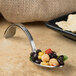 A Bon Chef stainless steel sombrero tasting spoon filled with beans and corn.