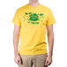 A man wearing a yellow "We Squeeze To Please" T-shirt with a green design.