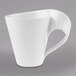 A close-up of a Villeroy & Boch NewWave white coffee mug with a curved handle.