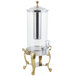 A Bon Chef stainless steel beverage dispenser with a brass finish and ice chamber.