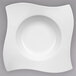 A white Villeroy & Boch porcelain pasta plate with a wavy design.