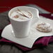 A cup of coffee with a cookie on a Villeroy & Boch NewWave porcelain party plate.
