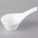 A white bowl with a handle and a spoon.