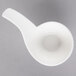 A Villeroy & Boch white porcelain dip bowl with a handle and a spoon on top.
