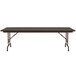 A Correll walnut adjustable height folding table with a metal frame.