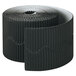 A roll of corrugated black paper with a decorative edge.