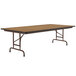 A Correll rectangular wood folding table with metal legs.