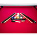 A Mizerak Donovan II pool table with cues and balls.