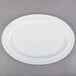 A white oval platter with a rim.