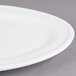 A close-up of a Libbey Alpine White Porcelain Platter with a rim.