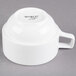 A Libbey Alpine White porcelain stacking cup with a handle.