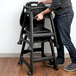 Lancaster Table & Seating Ready-To-Assemble Black Stackable Restaurant High Chair with Tray and Wheels Main Thumbnail 6