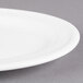 A close up of a Libbey alpine white porcelain platter with a rim.
