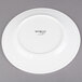A white Libbey porcelain plate with black text that says "World"