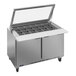 A Beverage-Air stainless steel refrigerated sandwich prep table with glass lids.