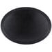 A black oval Carlisle Griptite non skid serving tray.